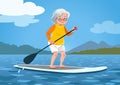 Senior woman on a stand up paddle board. Cute grandma wearing ra