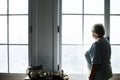 Senior woman standing alone at home Royalty Free Stock Photo