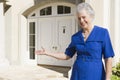 Senior woman standing outside home Royalty Free Stock Photo