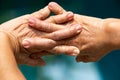 Senior woman stretching herself in bokeh blue swimming pool background, Close up & Macro shot, Selective focus, Healthcare concept Royalty Free Stock Photo