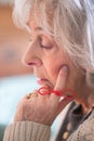 Close Up Of Senior Woman With String Tied Around Finger As Reminder Royalty Free Stock Photo