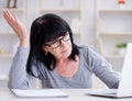 Senior woman struggling at computer Royalty Free Stock Photo