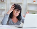 Senior woman struggling at computer Royalty Free Stock Photo