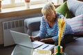 Senior woman studying at home, getting online courses Royalty Free Stock Photo