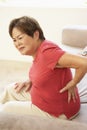 Senior Woman Suffering From Back Pain At Home Royalty Free Stock Photo