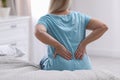 Senior woman suffering from back pain at home Royalty Free Stock Photo