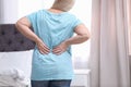 Senior woman suffering from back pain at home Royalty Free Stock Photo