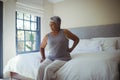 Senior woman suffering from back pain at home Royalty Free Stock Photo