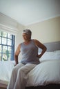 Senior woman suffering from back pain at home Royalty Free Stock Photo