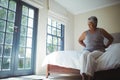 Senior woman suffering from back pain at home Royalty Free Stock Photo