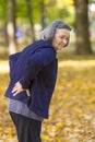 Senior woman suffering from backache outdoors Royalty Free Stock Photo