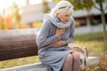 Senior Woman Suffering From Chest Pain