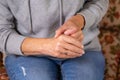 Senior woman suffering from hand and finger joint pain, inflammation Royalty Free Stock Photo