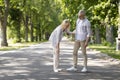 Senior Woman Suffering Knee Injury While Walking In Park With Husband Royalty Free Stock Photo