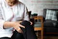 Senior woman suffering from knee pain at home, health problem concept Royalty Free Stock Photo