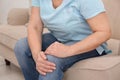 Senior woman suffering from knee pain at home Royalty Free Stock Photo