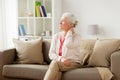 Senior woman suffering from neck pain at home Royalty Free Stock Photo