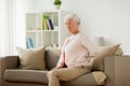 Senior woman suffering from pain in back at home Royalty Free Stock Photo