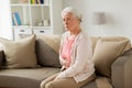Senior woman suffering from stomach ache at home Royalty Free Stock Photo