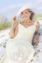 Senior Woman In Sun Dress & Hat At Beach Royalty Free Stock Photo