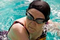 Senior Woman Swimming in a pool Royalty Free Stock Photo