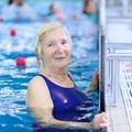 Senior woman swimming in the pool Royalty Free Stock Photo