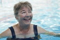 Senior woman swimming at the pool Royalty Free Stock Photo