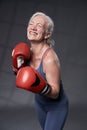 Senior woman taking boxing lessons