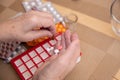 Senior Woman Taking Prescription Medicine and Organizing Pill Box