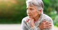 Senior woman, thinking and peace in park for retirement, pension and grandma in nursing home for old age. Female person Royalty Free Stock Photo