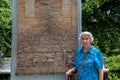 Senior woman tourist visiting the commemorative monument of the Armero tragedy caused by the Nevado