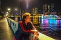 Senior women traveler stand beside Pearl River in Guangzhou city China