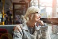 Senior Woman Traveling In Bus