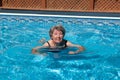 Senior woman trying to swim Royalty Free Stock Photo