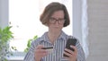 Senior Woman Unable to Shop Online on Smartphone