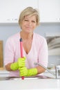 senior woman unblocking sink