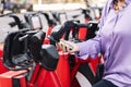 senior woman unlocking rental bike with mobile app