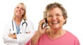 Senior Woman Using Cell Phone with Female Doctor Royalty Free Stock Photo