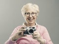 Senior woman using a digital camera Royalty Free Stock Photo