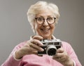 Senior woman using a digital camera Royalty Free Stock Photo