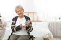 Senior woman using digital glucometer. Diabetes control