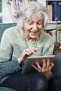 Senior Woman Using Digital Tablet At Home Royalty Free Stock Photo