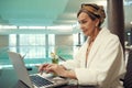 Senior Woman Using Laptop in SPA Resort Royalty Free Stock Photo