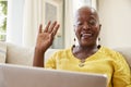 Senior Woman Using Laptop To Connect With Family For Video Call