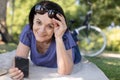 senior woman using smartphone in park Royalty Free Stock Photo