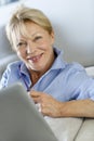 Senior woman using tablet at home Royalty Free Stock Photo
