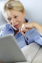 Senior woman using tablet at home Royalty Free Stock Photo