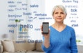 Senior woman using translator on smartphone