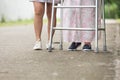 Senior woman using a walker with caregiver Royalty Free Stock Photo