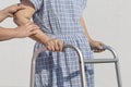 Senior woman using a walker with caregiver Royalty Free Stock Photo
